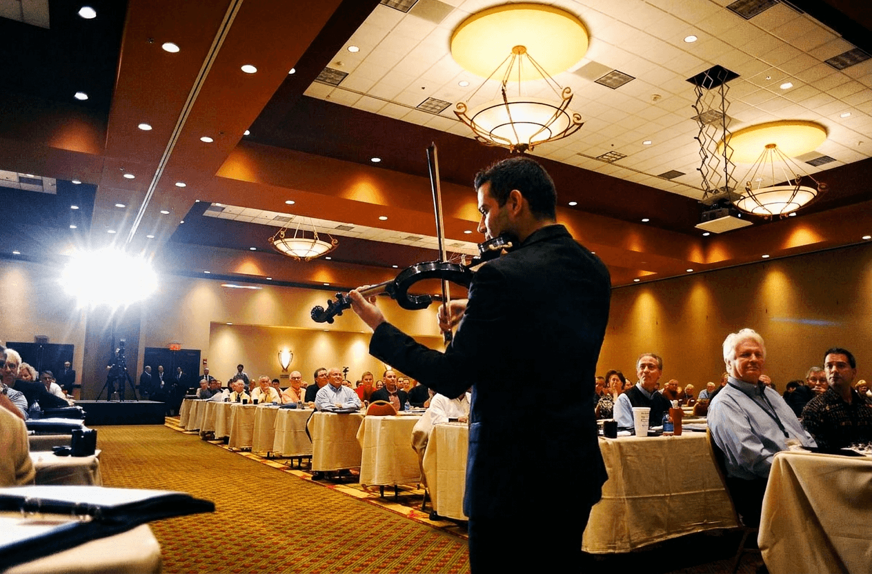David Chirinos performing for seated guests at a corporate event in Orlando