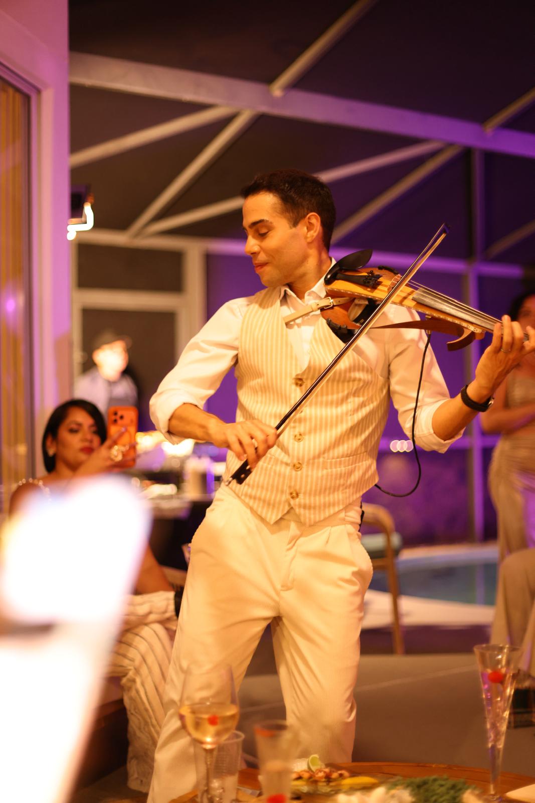 David Chirinos performing at a private poolside celebration