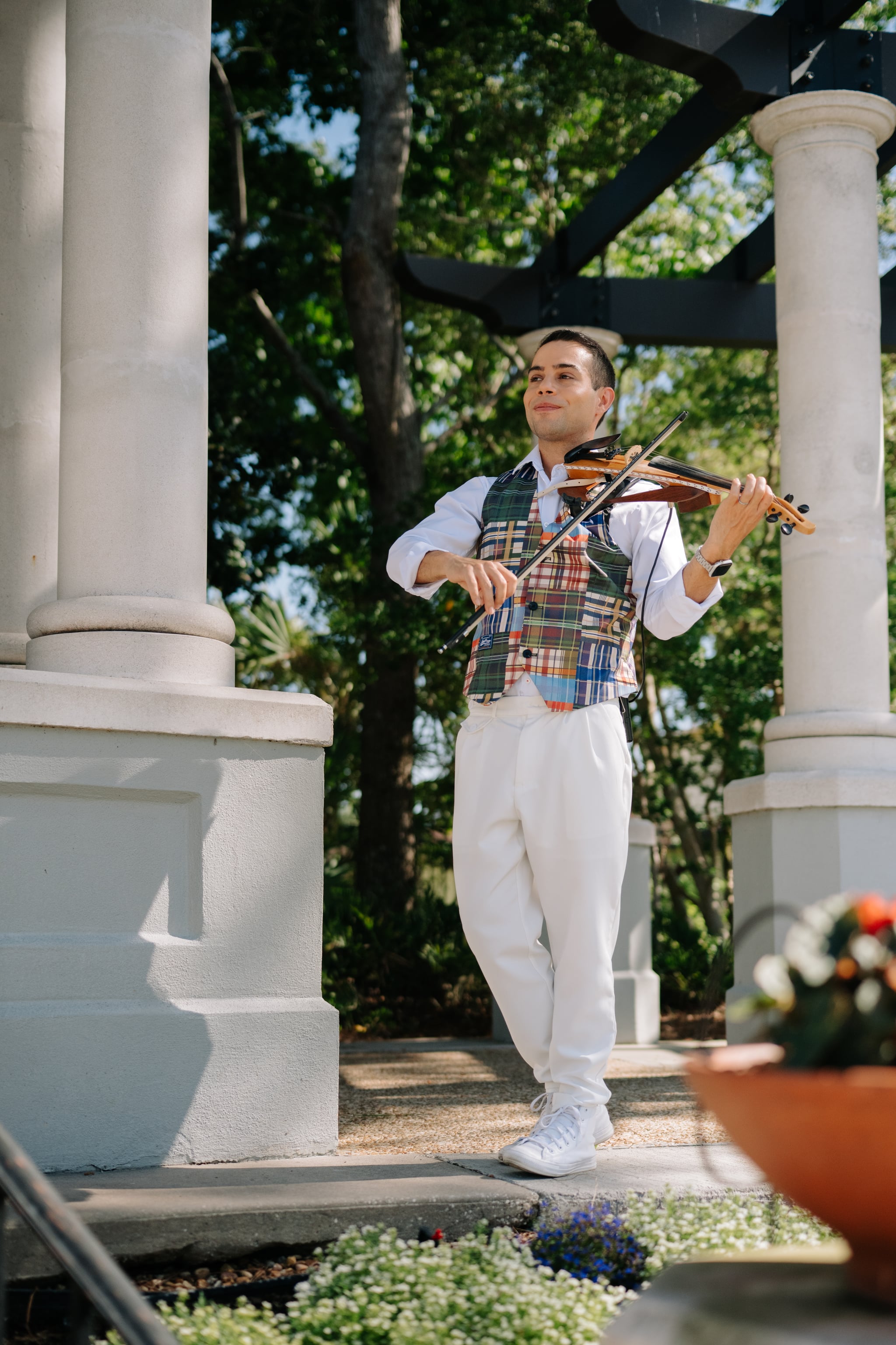 David Chirinos playing violin at an outdoor wedding ceremony in Central Florida